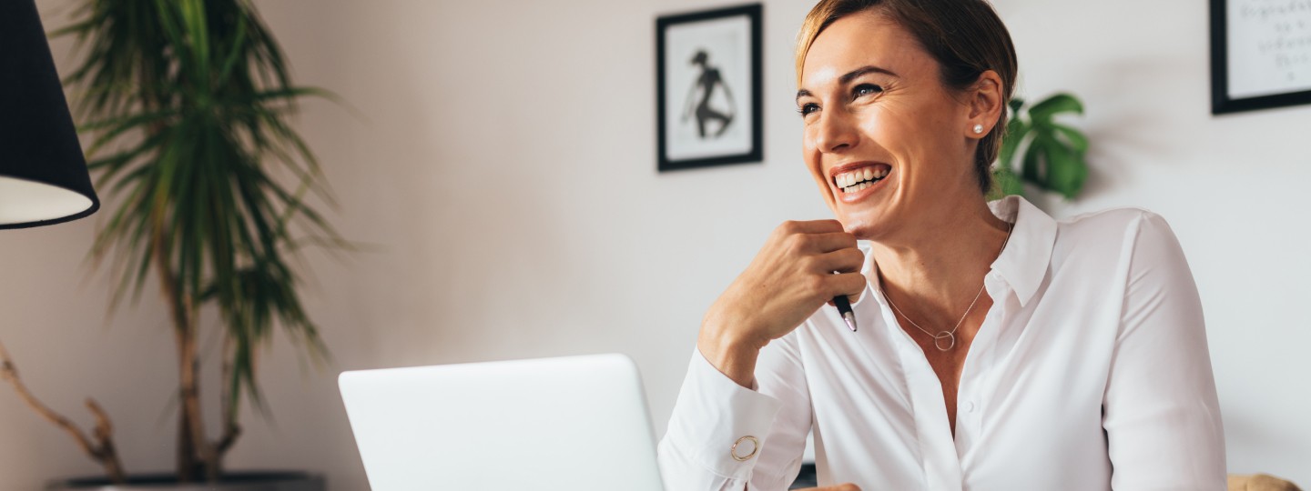 Woman at desk smiling